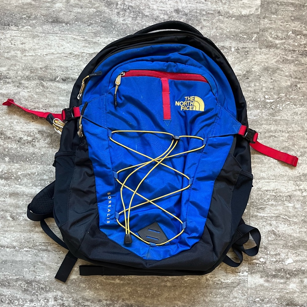 The North Face Blue and Black Backpack with Red Accents